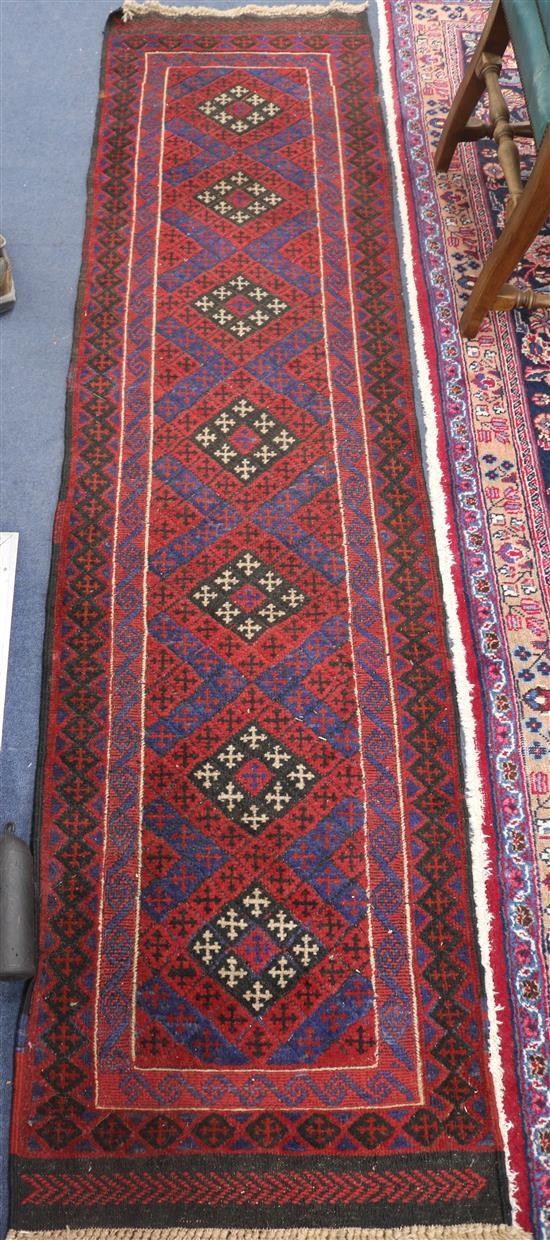 A persian red ground runner, 250 x 62cm